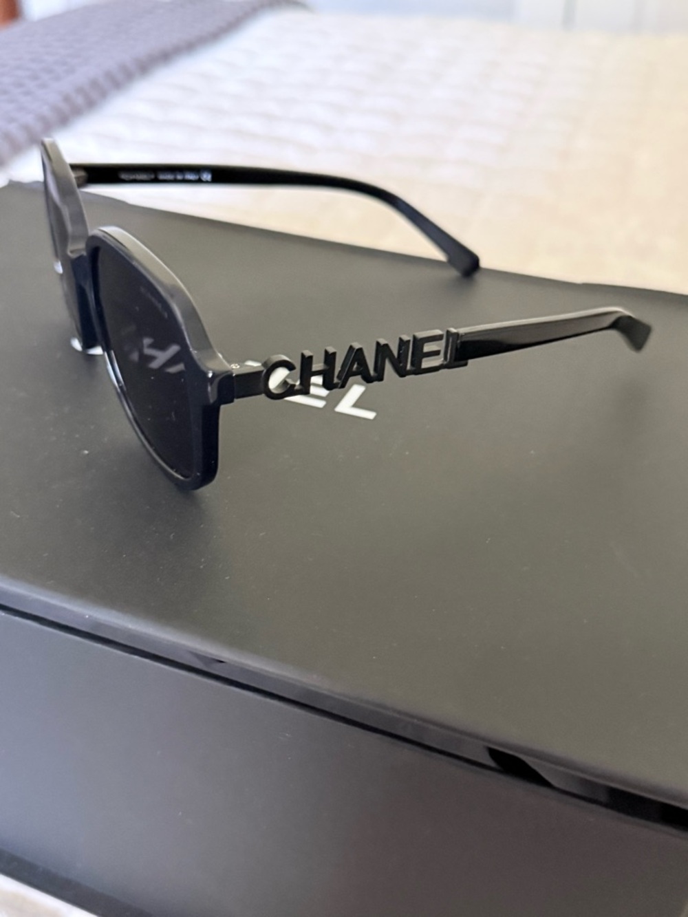 CHANEL Black Logo Arm Round Sunglasses with Bold Lettering